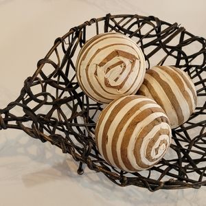 Weaved leaf deign basket with boho balls